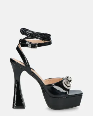 JANINE - tacchi alti con platform in glassy nero e fiocco con gemme